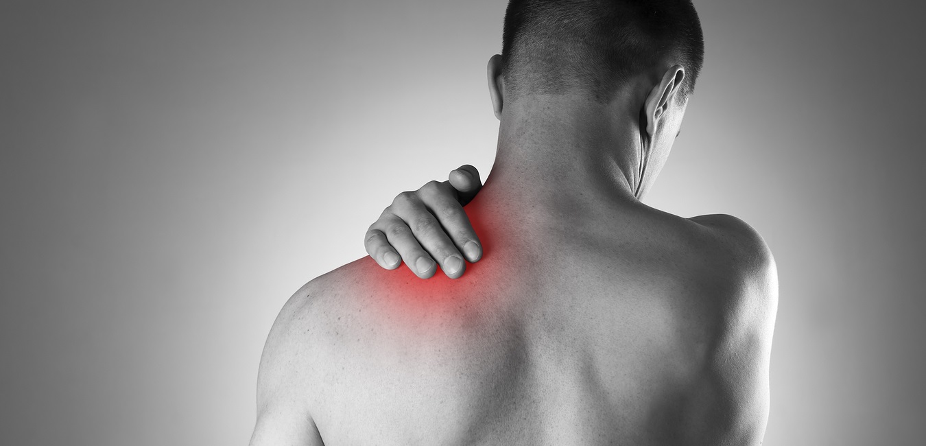 Man holding painful shoulder