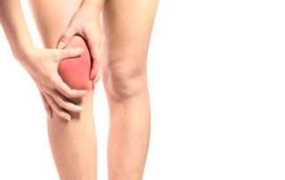 Women holding inflamed knee in pain